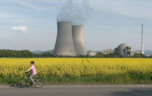 Nuclear power plant with boy on a bike